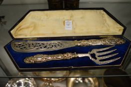 A cased pair of silver handled fish servers.