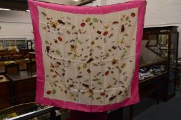 A Hermes silk head scarf decorated with insects.