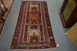 A Persian design rug with stylised geometric decoration 190cm x 102cm.