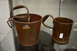 Two metal measures, one gallon and half gallon.
