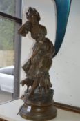 A large pair of spelter figures of a shepherdess and a huntsman (faults).
