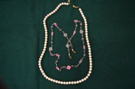 Two decorative necklaces.