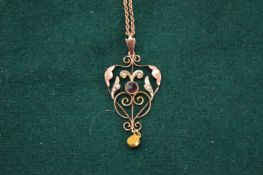 A Victorian rose gold, tourmaline and pearl pendant with chain.
