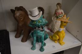 An amusing turquoise glazed pottery model of a cat wearing a top hat by Mosanic together with a