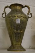 A good Islamic engraved brass twin handled vase.