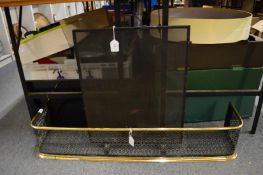 A spark guard and a brass fire guard.