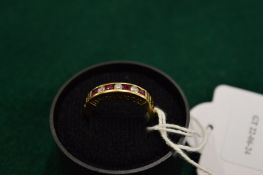A 9ct gold, ruby and cubic zirconia ring, pierced to the side 'I love you', size O.