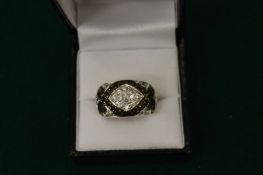 A silver, diamante and black stone ring, boxed.