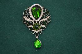 A large simulated emerald pendant/brooch.