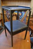 An ebonised and gilt decorated two-tier single drawer wash stand or occasional table.