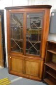 A large 19th century mahogany four door standing corner cabinet.