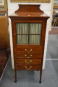 An Edwardian inlaid mahogany side or music cabinet.