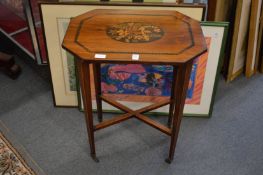 A decoratively inlaid pine and mahogany occasional table.