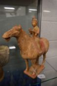 A Tang style pottery horse and rider.