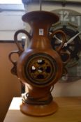 A large pottery table lamp.