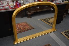 A Victorian style gilt framed over-mantle mirror.