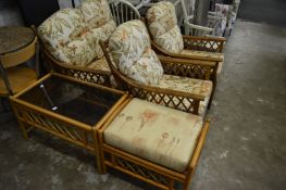 A bamboo conservatory three piece suite together with similar stool and glass top table.
