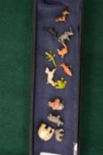 A collection of miniature cold painted animals.