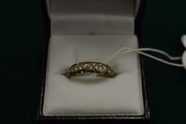 A 9ct gold and cubic zirconia ring.