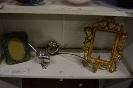 Two decorative photograph frames, a ladle and tea light holder modelled as a bird.