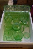 A green glass dressing table set.