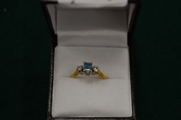 An 18ct gold, aquamarine and diamond ring, size K.