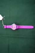 A ladies purple coloured wristwatch.