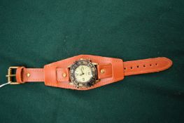 A Gents quartz wristwatch with leather strap.