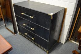 An unusual blue leather upholstered three drawer bedroom chest.