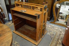 A Chinese pine and brass mounted open cabinet.