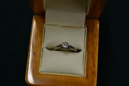 An 18ct gold and platinum single stone diamond ring, size K.