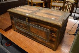 An Eastern brass bound hardwood trunk.