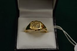 A 9ct gold signet ring set with a small diamond, size Z.