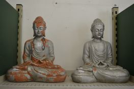 A pair of painted terracotta Buddha's.