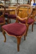 A set of six Victorian mahogany balloon back dining chairs.