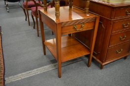 A mahogany two-tier single drawer occasional table.