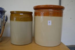 A Doulton stoneware jar and another similar.