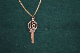 A 9ct gold chain set with a number 18 pendant.