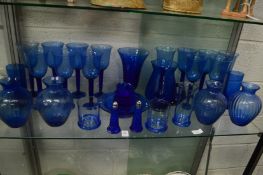 Large collection of blue glassware.