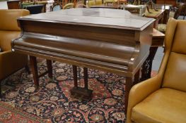 A Challen baby grand piano.