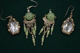 Two pairs of decorative earrings.