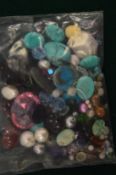Two large cabochon rubies and various other stones.