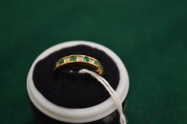 A 9ct gold, emerald and diamond ring, size O.