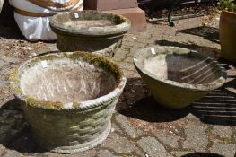 Three reconstituted stone garden planters.