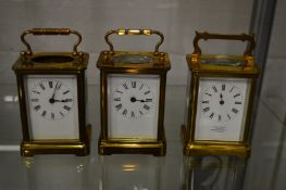 Three brass carriage clocks (af).