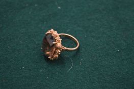 A 9ct gold and citrine ring, size L.