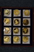 A set of twelve Churchill Commemorative coins, boxed.
