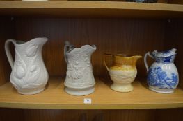 Three decorative jugs.