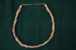 A two tone flexible necklace.