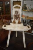 A pair of unusual Continental carved and painted three legged chairs with folding backs.